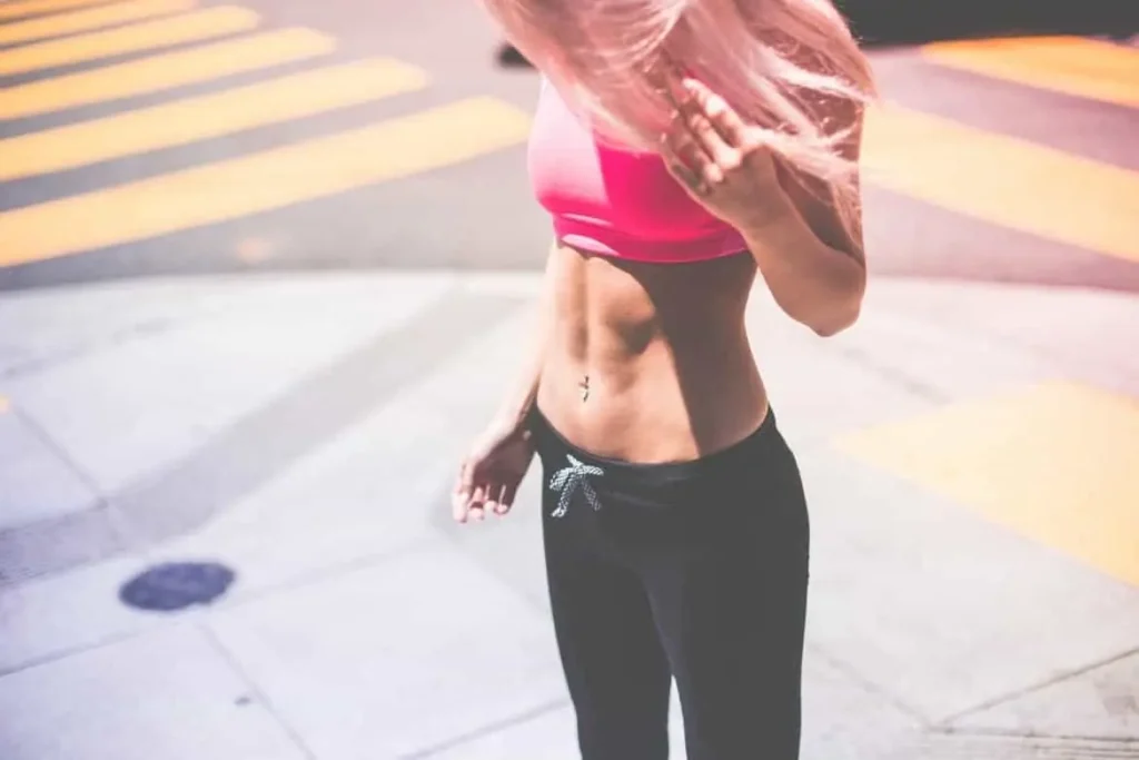 Woman with toned stomach after LA-EMS Body Sculpting Treatment Stanford-le-Hope
