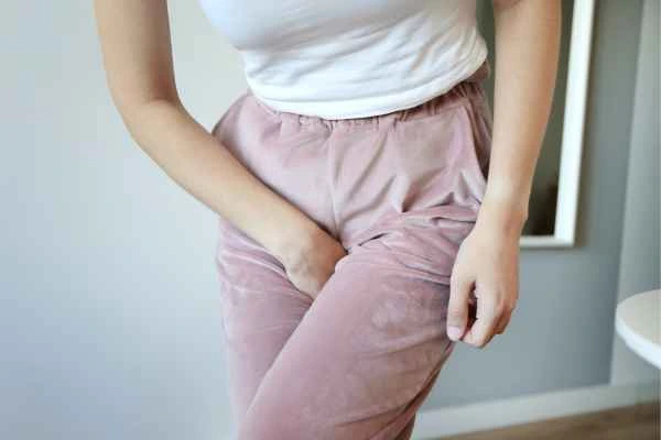 woman running for the toilet because of urinary incontinence Stanford-le-Hope